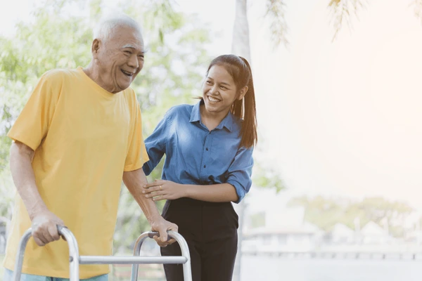 Companion caregiver reading with a senior